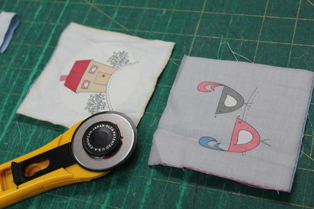 pieces of fabric and a rotary cutter - from A Quick and Simple Needlebook Tutorial by Helen of Hugs 'n Kisses