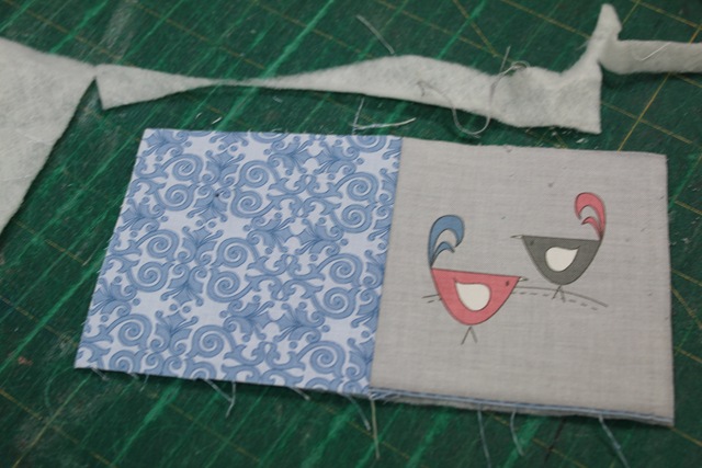 two pieces of square fabrics - from A Quick and Simple Needlebook Tutorial by Helen of Hugs 'n Kisses