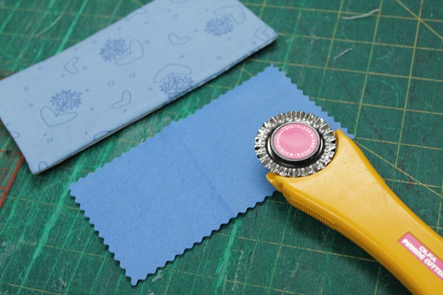 two pieces of rectangle fabrics and a rotary cutter - from A Quick and Simple Needlebook Tutorial by Helen of Hugs 'n Kisses