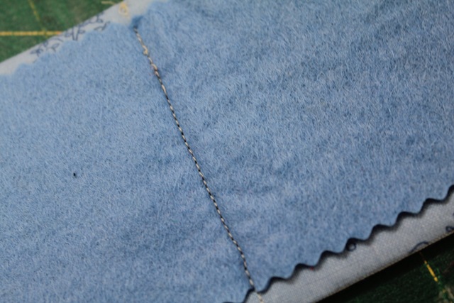 a piece of stitched blue fabric - from A Quick and Simple Needlebook Tutorial by Helen of Hugs 'n Kisses