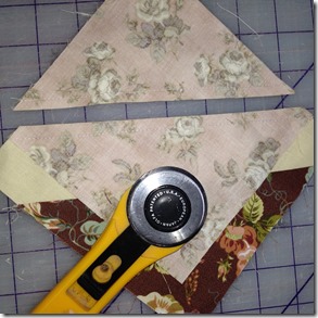 pieces of fabrics and a rotary cutter - love thy neighbour quilt tutorial by hugs 'n kisses